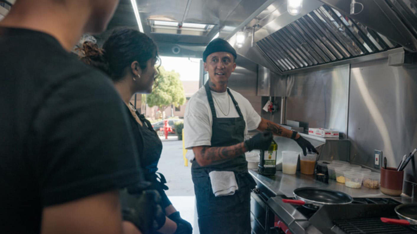 Chef Phillip Esteban with culinary students at Morse High School