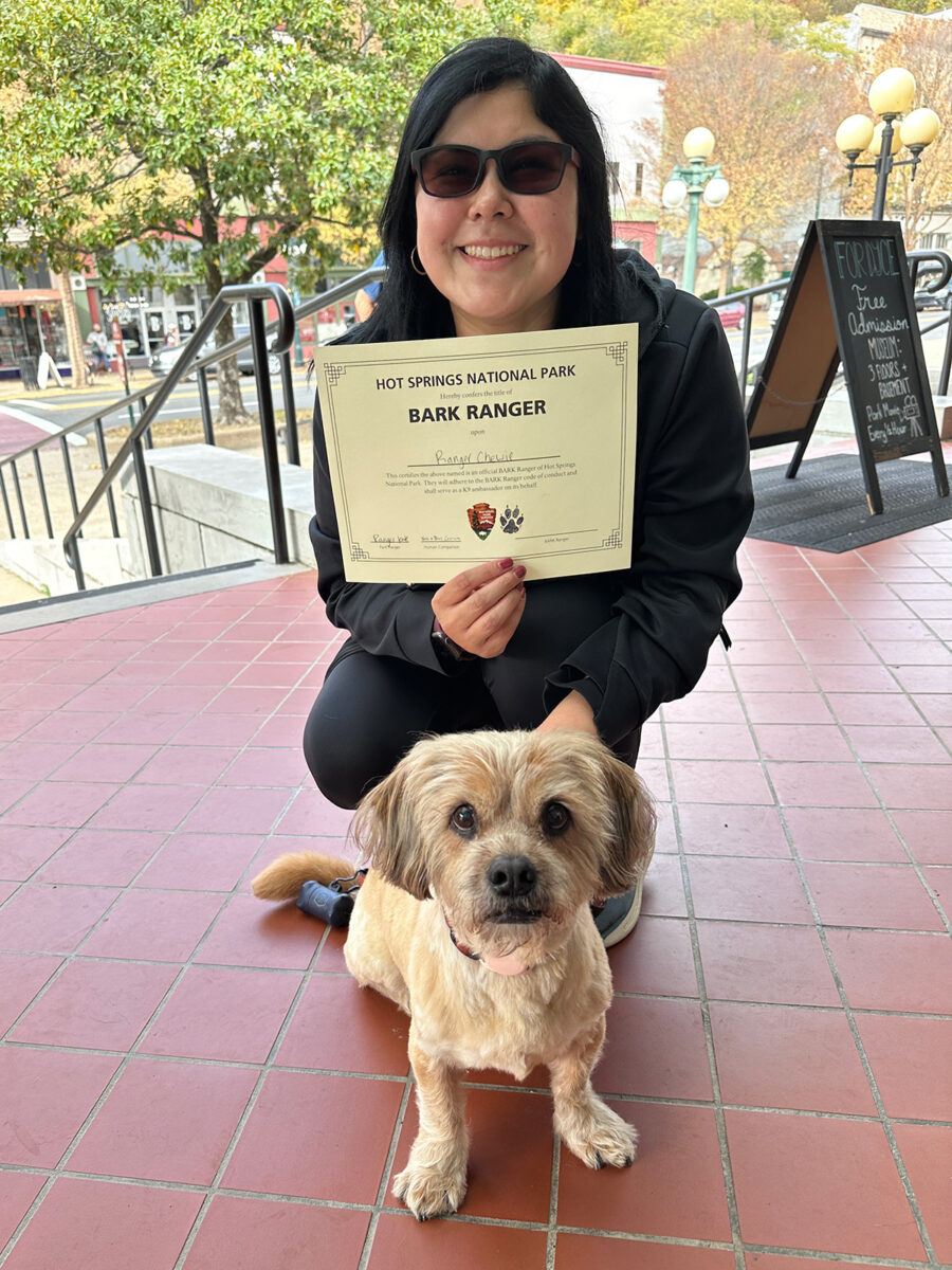 Veronica Garcia, content designer posing with her dog Chewie